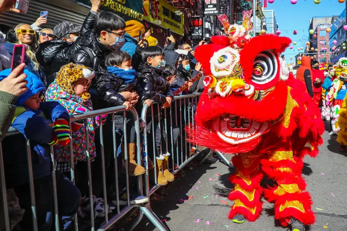 Parade participants and spectators at the Lunar New Year Parade in Chinatown, February 2022